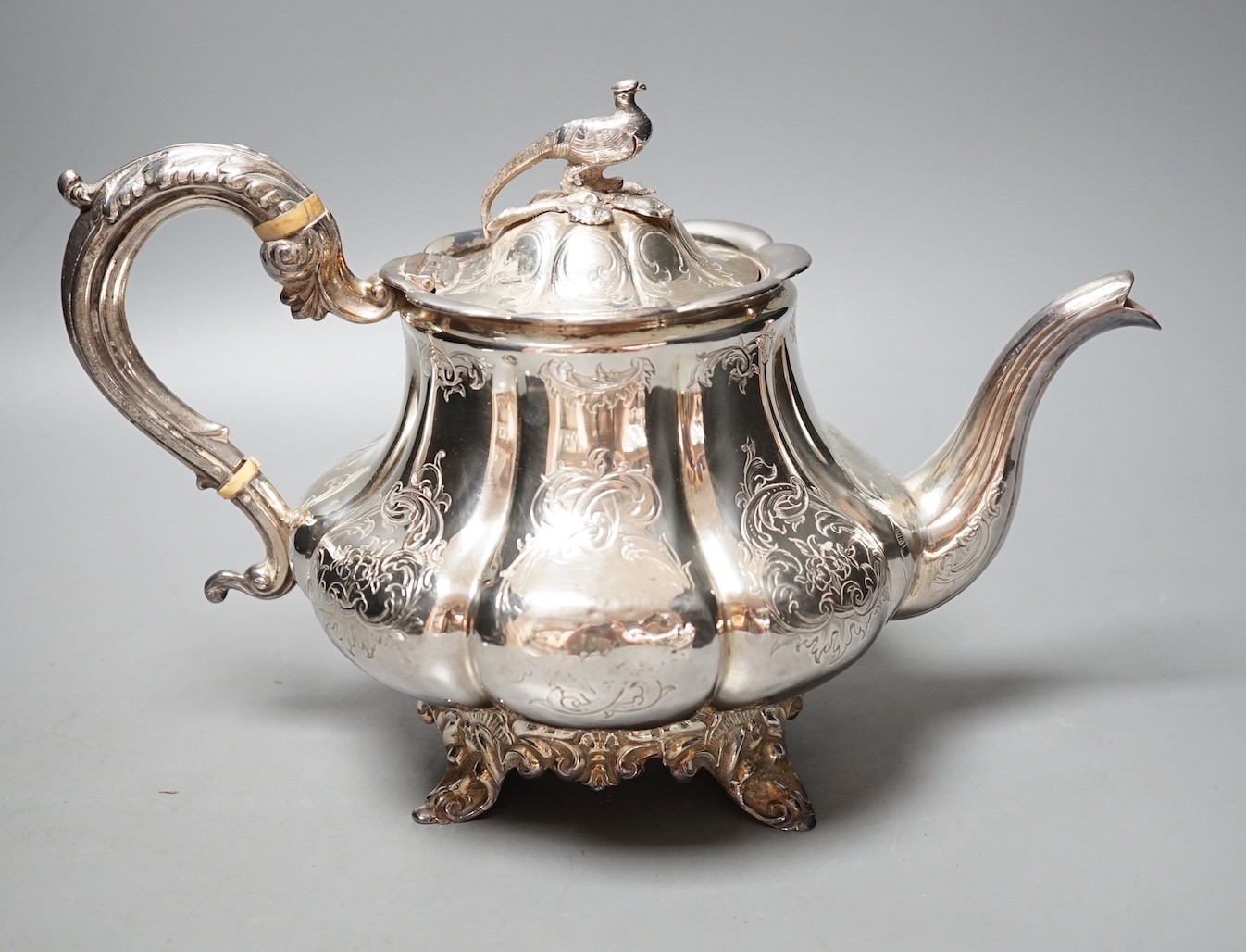 An early Victorian silver teapot, with bird finial, William Hewitt, London, 1844, gross 26.5oz.